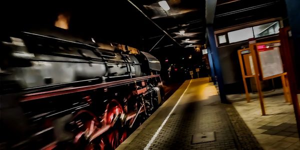 Train at railroad station at night