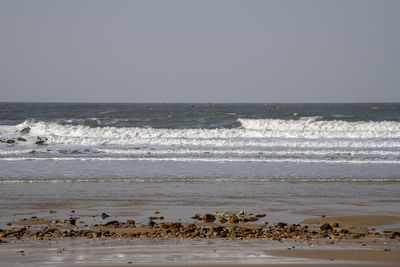 Scenic view of sea against clear sky
