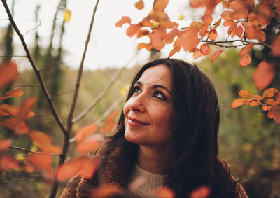 Portrait of young woman looking away