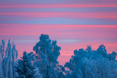 Scenic view of landscape against sky at sunset