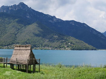 Scenic view of lake and mountains against sky