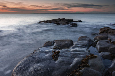 Scenic view of sea against sky during sunset