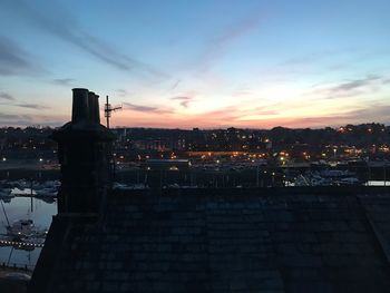 Cityscape against sky at dusk
