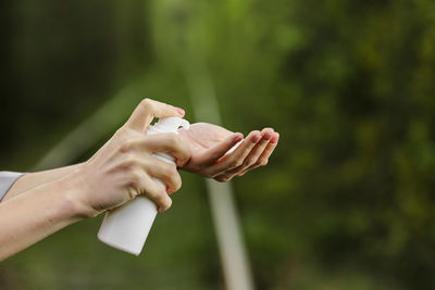 Cropped hand of woman with nail polish