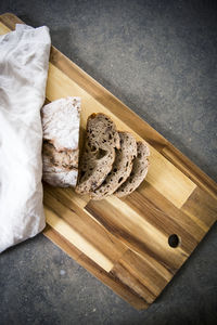 High angle view of bread on cutting board