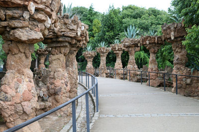 View of stone wall with trees in background