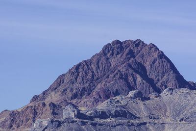 Scenic view of mountains against clear blue sky