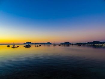 Scenic view of sea against clear sky at sunset