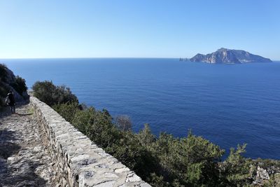 Scenic view of sea against clear blue sky