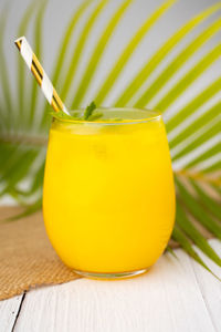 Close-up of yellow drink on table