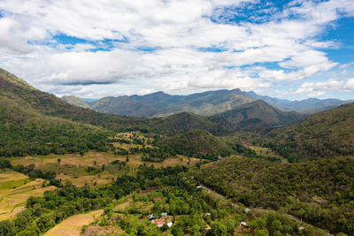 Aerial drone of rice fields and terraces in a valley among the mountains. 