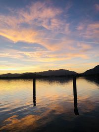 Scenic view of lake against sky during sunset