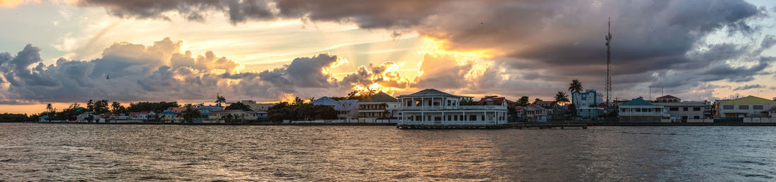 Panoramic view of buildings against sky during sunset