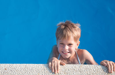 Portrait of smiling boy in swimming pool