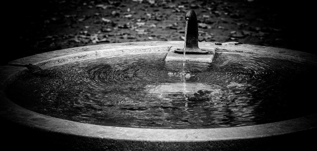 CLOSE-UP OF WATER FOUNTAIN IN OLD BUILDING