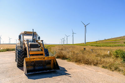 Scenic view of agricultural field against clear sky