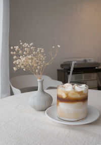 Close-up of coffee in vase on table