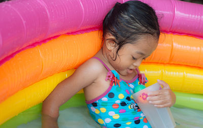 Girl playing in wading pool