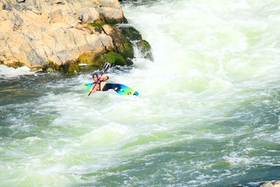 People surfing in sea