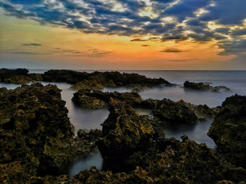 Scenic view of sea against sky at sunset