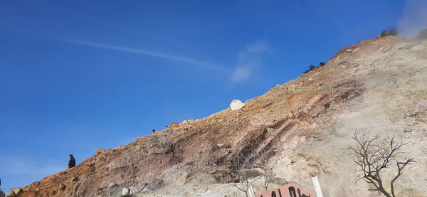 Low angle view of rock formation against sky