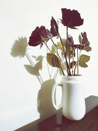 Close-up of white flower vase on table