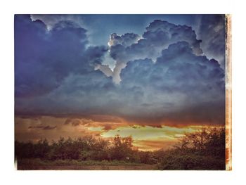 Digital composite image of dramatic sky during sunset