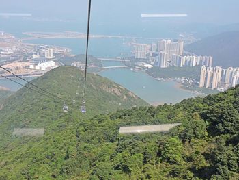 High angle view of buildings in city against sky
