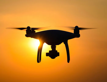 Silhouette of a drone at sunset