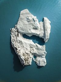 High angle view of white table against blue background