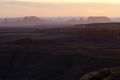 Scenic view of rocky mountains against sky during sunset