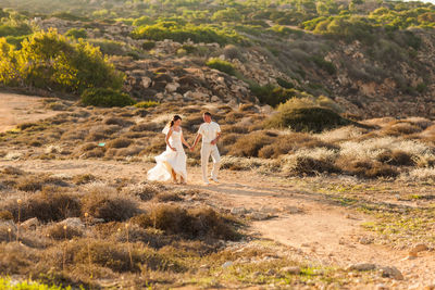 Friends standing on field