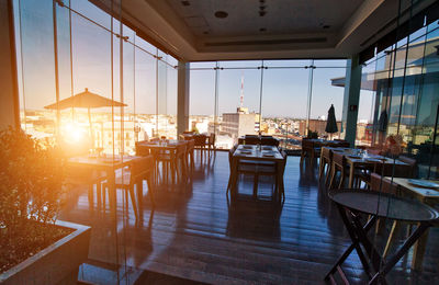 Empty chairs and tables in restaurant