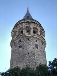 Low angle view of galata tower against clear sky