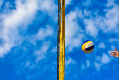 Low angle view of basketball hoop against blue sky