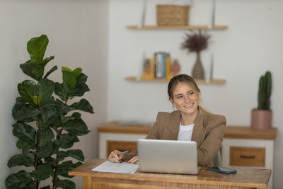 Woman working at home with laptop. home office.  notebook for working. 