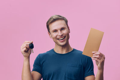 Portrait of young man using mobile phone