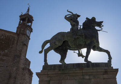 Low angle view of statue against sky