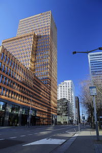 Low angle view of modern buildings against clear sky