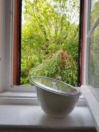 Close-up of balcony seen through window