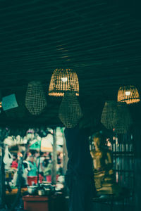 Close-up of illuminated lanterns hanging from ceiling
