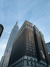 Low angle view of modern buildings against sky