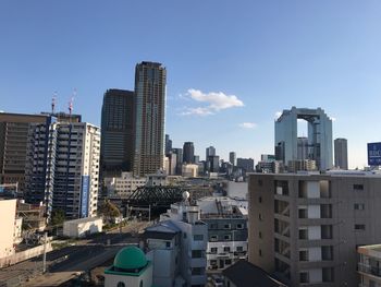 Modern buildings in city against sky