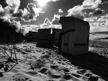 Built structure on beach against sky