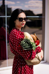 Portrait of young woman wearing sunglasses