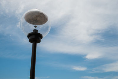 Low angle view of street light against sky