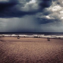 Scenic view of sea against cloudy sky