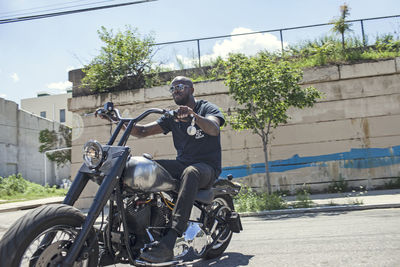 Man riding motorcycle on road