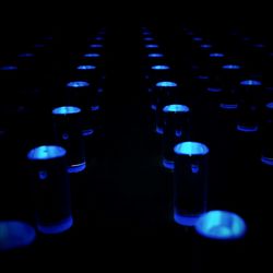 Close-up of illuminated lamp over black background