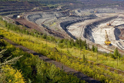 Concept of mineral development - open-pit mining of iron ore, top view.